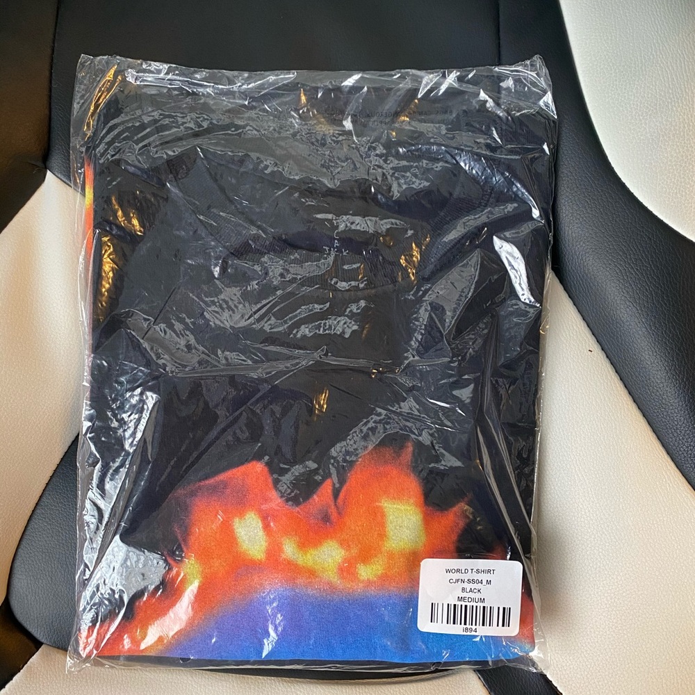 Travis Scott World t shirt in hand
